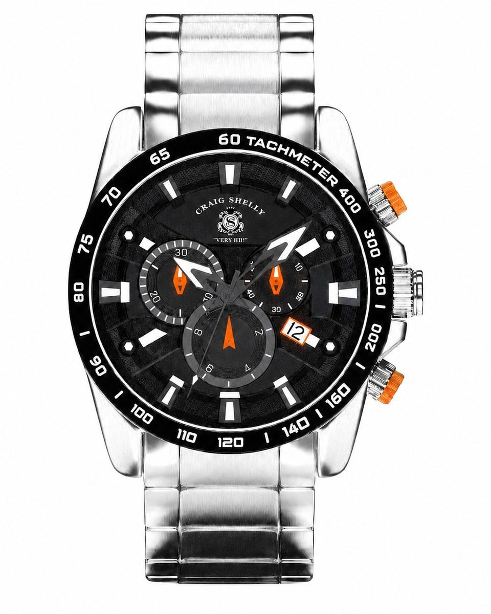 The Power Player chronograph: a black dial with orange accents, a tachymeter bezel and a steel bracelet.
