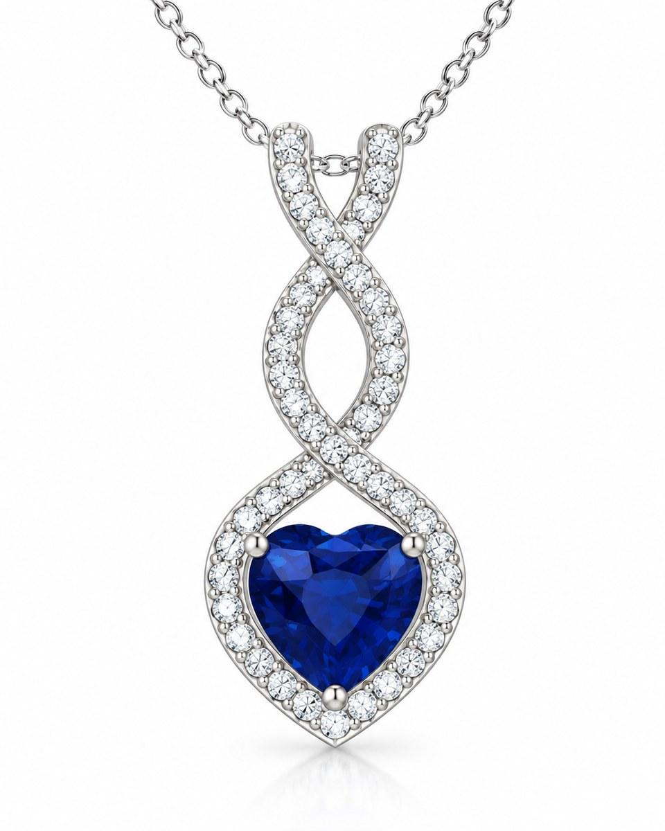 The Kiçh Aura Infinite Heart Diamond Pendant: a blue heart-shaped stone in a twisting frame of small stones, on a fine chain.