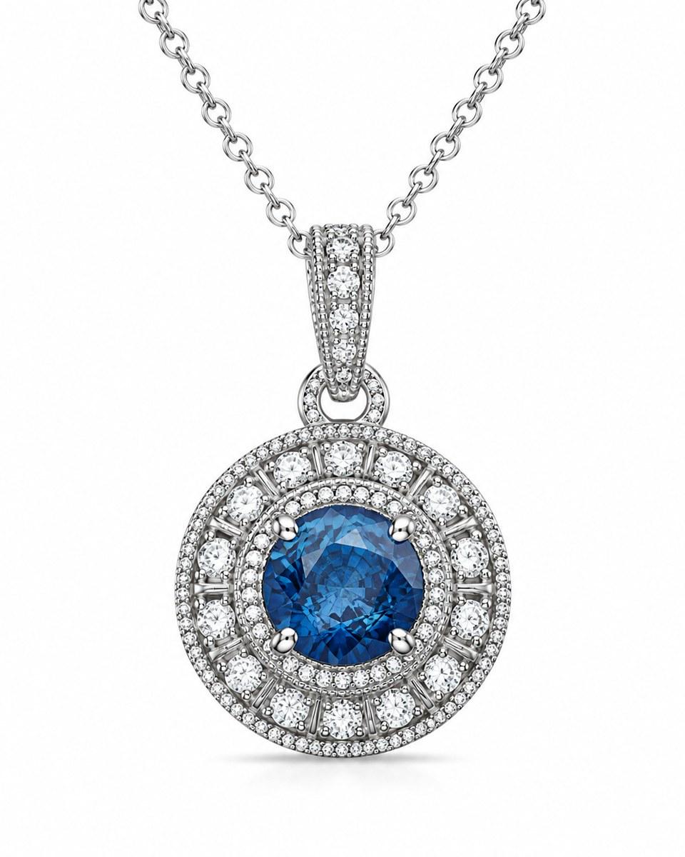 The TruAmore Blue Imperial Radiance Pendant: a round blue stone inside rings of small clear stones, on a chain.