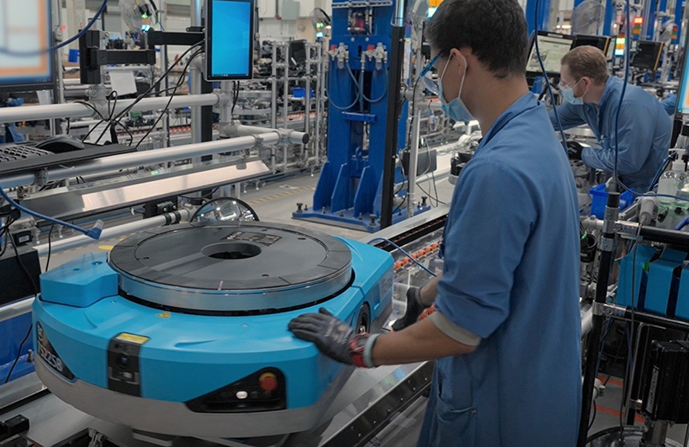 A Proteus mobile robot on an Amazon manufacturing line.