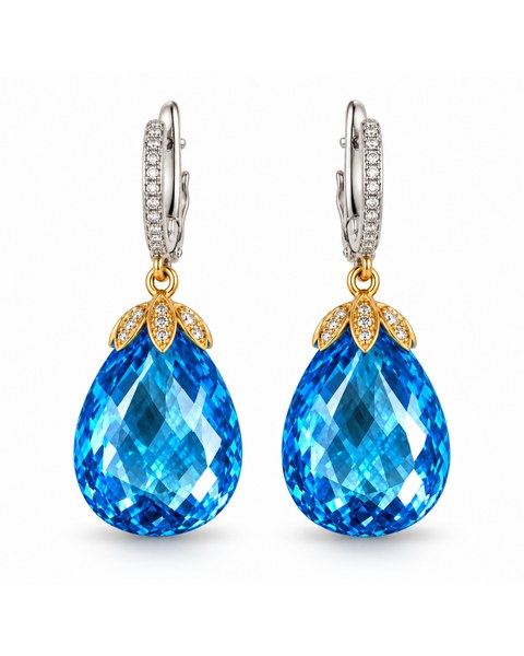 Blue teardrop earrings with a leaf-shaped cluster above each stone.