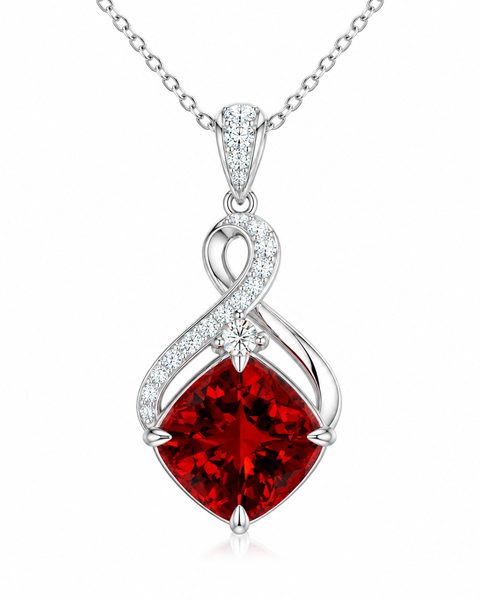 A red cushion-cut stone within an infinity-inspired white-metal pendant.